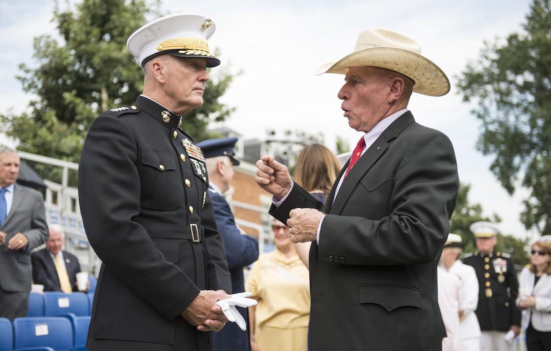 Marine Corps Gen. Joe. Dunford, left, chairman of the Joint Chiefs of Staff, speaks with retired Marine Corps Sgt. Maj. Harold G. Overstreet, a former sergeant major of the Marine Corps, before a naming ceremony for the USS Harvey C. Barnum Jr. at Marine Barracks Washington, D.C., July 28, 2016. Barnum, a Vietnam War veteran and Medal of Honor recipient, also attended the ceremony to name the ship, which will be an Arleigh Burke-class guided-missile destroyer. DoD photo by Army Sgt. James K. McCann