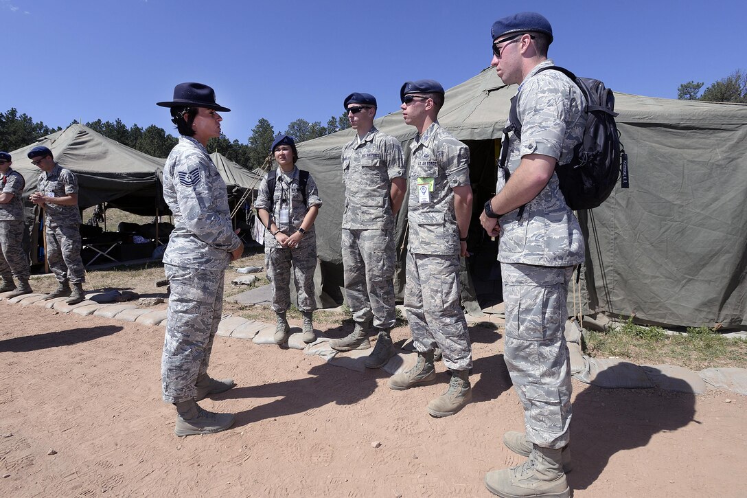 Tech. Sgt. Giselle Janousek, a military training instructor from Lackland Air Force Base, Texas, mentors cadet cadre during a visit to the Air Force Academy's Jacks Valley. Lackland MTIs joined cadet cadre in Jacks Valley this week as part of an Air Education and Training Command and USAFA training partnership. (U.S. Air Force photo by Mike Kaplan)