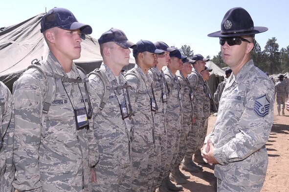 Master Sgt. James Correll, a military training instructor from Lackland Air Force Base, Texas, makes corrections on basic cadet trainees at the U.S. Air Force Academy's Jacks Valley. Lackland MTIs joined cadet cadre in Jacks Valley this week as part of an Air Education and Training Command and USAFA training partnership. (U.S. Air Force photo by Mike Kaplan)
