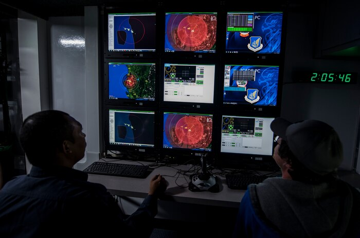 A Royal Malaysian Airman and a Joint Deployable Electronic Warfare Range (JDEWR) systems controller, monitor aircraft during Cope Taufan 16, at Pangkalan Udara Butterworth Air Base, Malaysia July 22, 2016.  RMAF Airmen where trained on the JDEWR system, helping them to improve their capabilities.  CT 16 allows for an exchange of techniques and procedures to enhance interoperability and cooperation between U.S. and Royal Malaysian Airmen. (U.S. Air Force photo by Tech. Sgt. Araceli Alarcon)