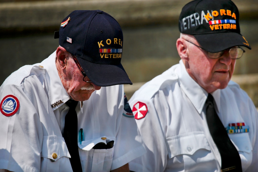 Korean War veterans listen to a speech during the National Korean War Veterans Armistice Day ceremony at the New Jersey Korean Veterans War Memorial in Brighton Park, Atlantic City, N.J., July 27, 2016. Air National Guard photo by Tech. Sgt. Matt Hecht