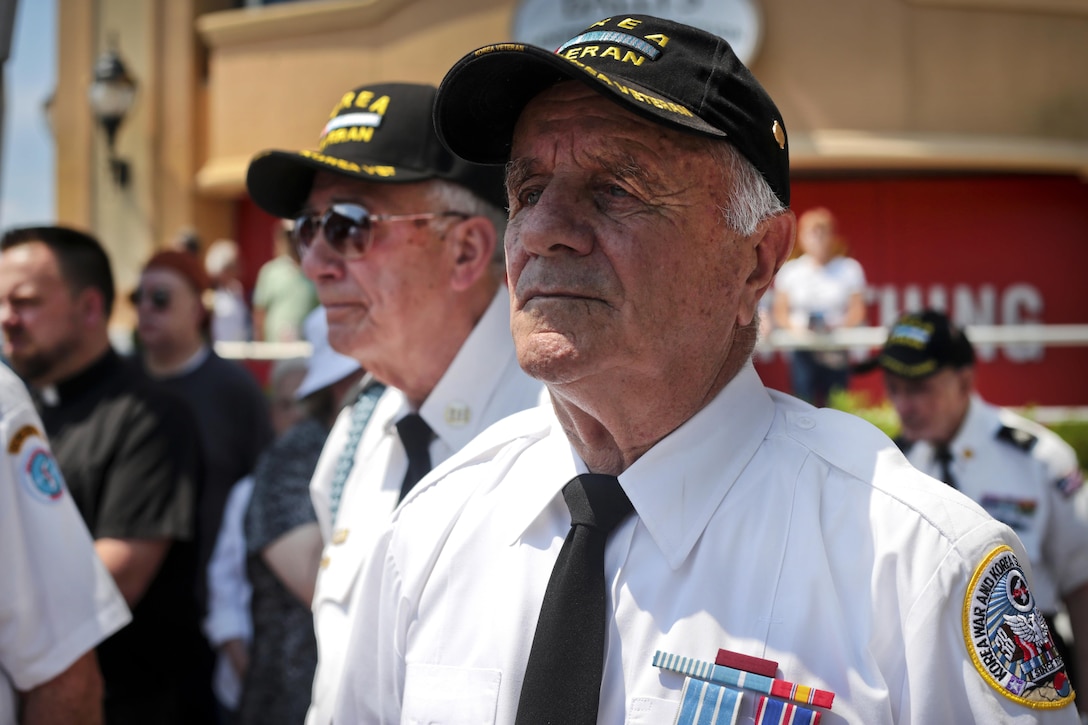 Korean War veterans observe a moment of silence during the National Korean War Veterans Armistice Day ceremony at the New Jersey Korean Veterans War Memorial in Brighton Park, Atlantic City, N.J., July 27, 2016. Air National Guard photo by Tech. Sgt. Matt Hecht