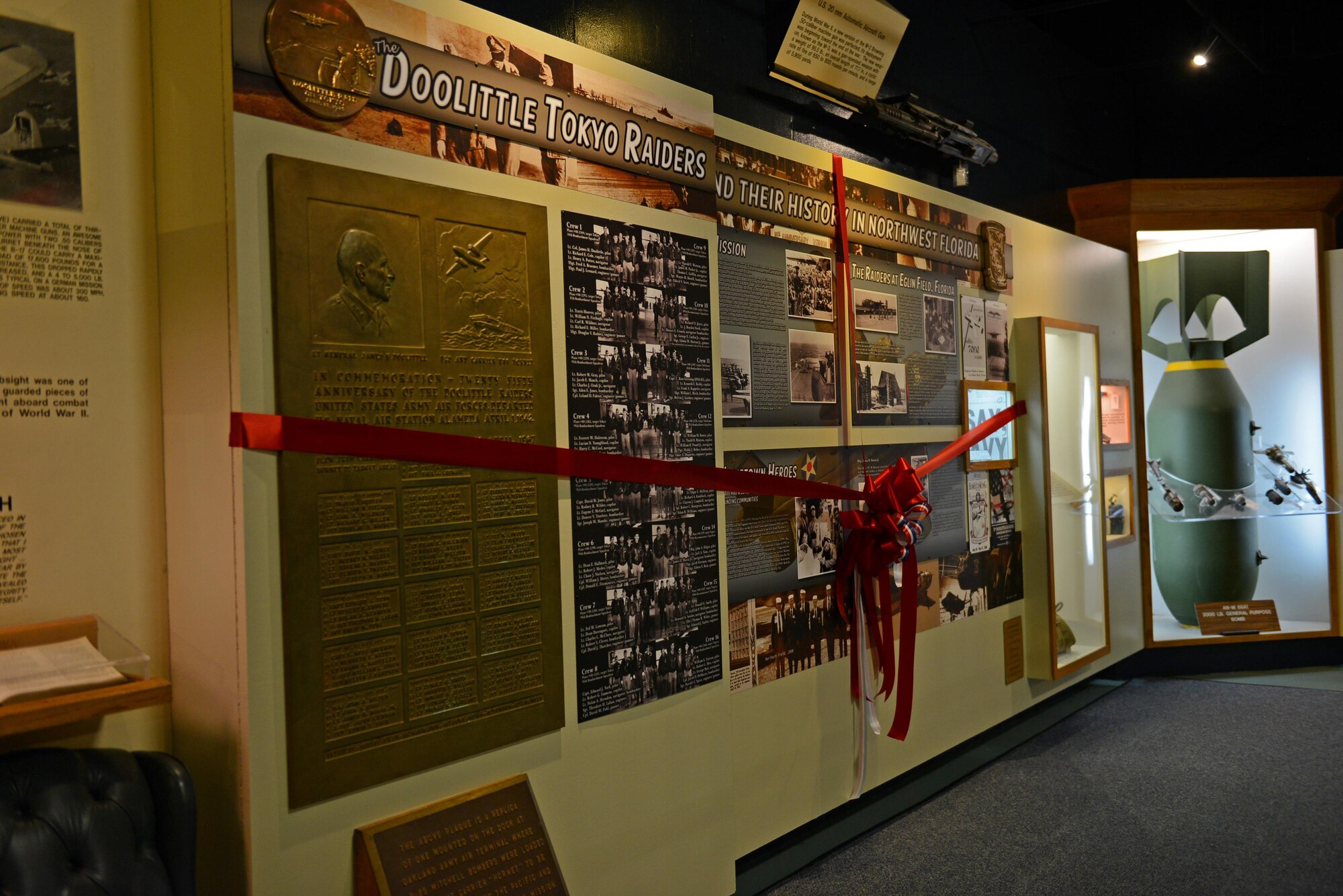 A ribbon surrounds the newly remodeled Doolittle Raider's exhibit at the U.S. Air Force Armament Museum on Eglin Air Force Base, Fla., July 30, 2016. (U.S. Air Force photo/Staff Sgt. Melanie Holochwost)