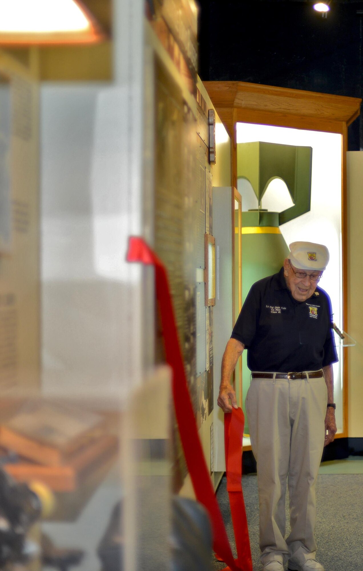 Lt. Col. (ret.) Richard “Dick” Cole pulled the ribbon to newly remodeled Doolittle Raider’s exhibit July 30, 2016 at the U.S. Air Force Armament Museum on Eglin Air Force Base, Fla. Cole, 100, is the final surviving member of the Doolittle Raiders. (U.S. Air Force photo/Staff Sgt. Melanie Holochwost)