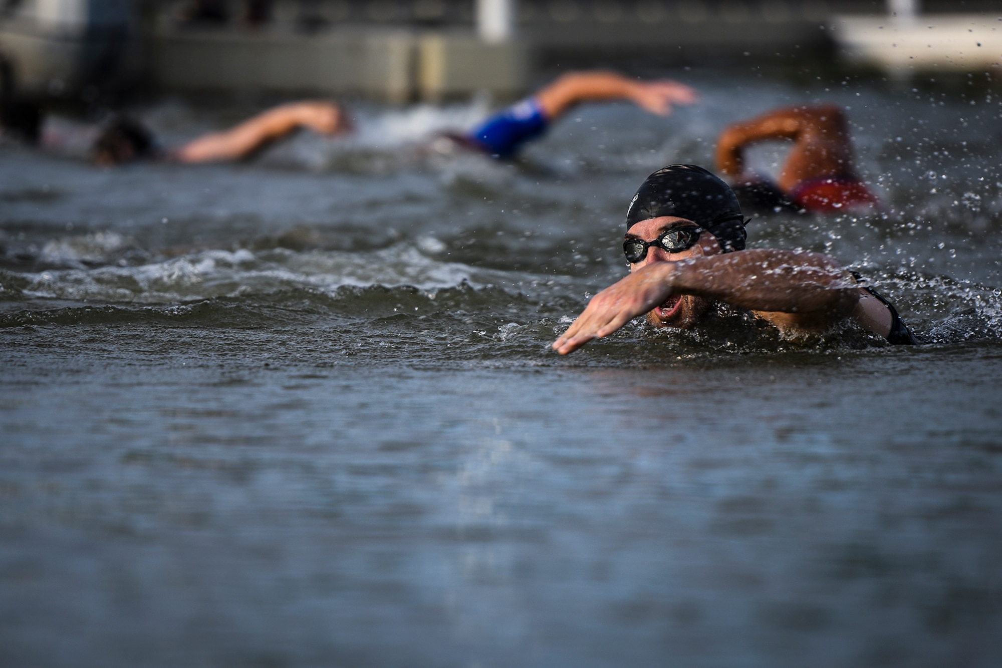 A swimmer makes a front crawl stroke during the Goodfellow Air Force Base Triathlon at the Goodfellow Recreation Camp in San Angelo, Texas, July 30, 2016. Civilians and military service members competed in the race which began with a 400-meter swim. (U.S. Air Force photo by Senior Airman Devin Boyer/Released)