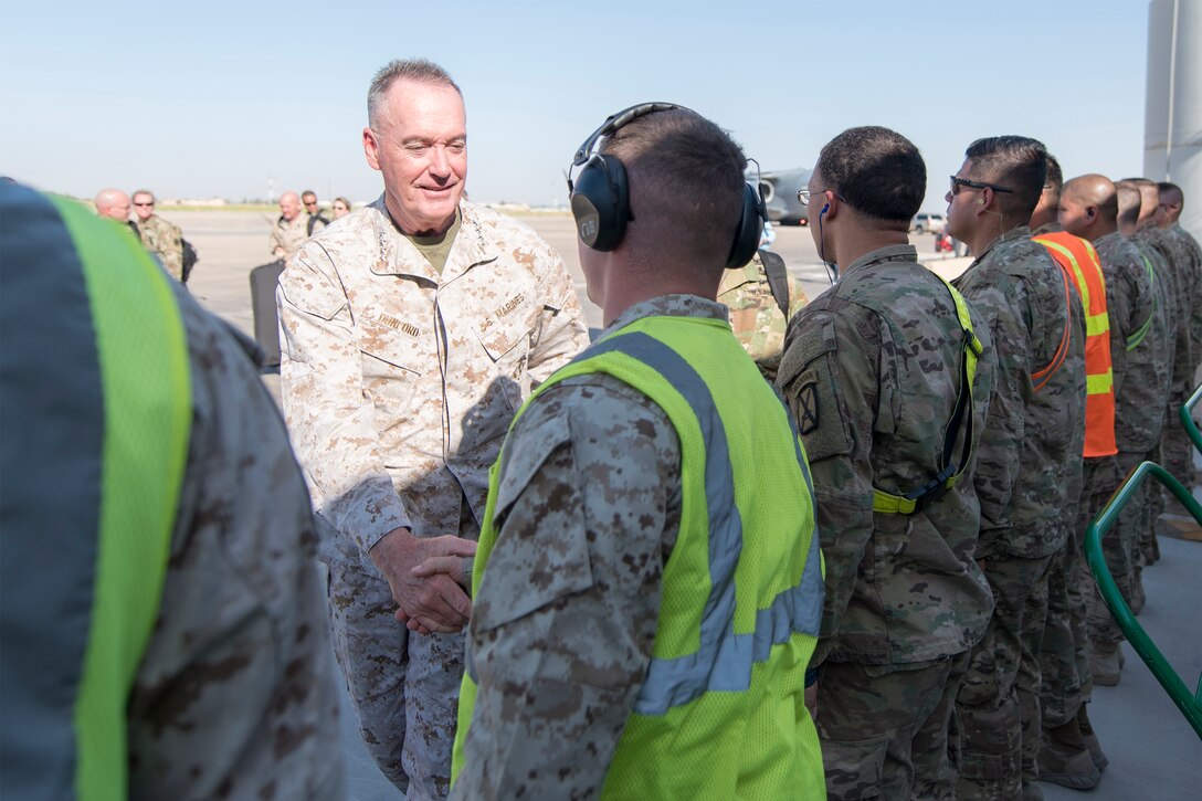Marine Corps Gen. Joe Dunford, chairman of the Joint Chiefs of Staff, speaks with service members after arriving in Baghdad, July 30, 2016. Dunford is in Iraq for talks with leaders on the status of the counter-Islamic State of Iraq and the Levant campaign. DoD photo by Navy Petty Officer 2nd Class Dominique A. Pineiro