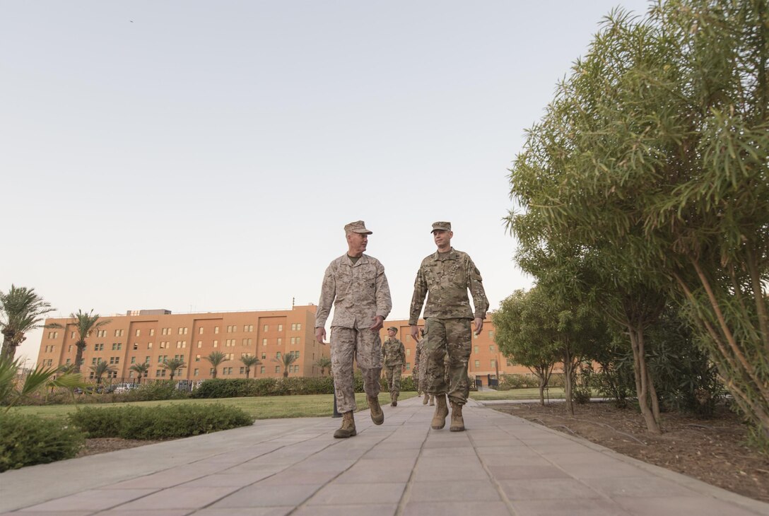Marine Corps Gen. Joe Dunford, chairman of the Joint Chiefs of Staff, speaks with Army Lt. Gen. Sean MacFarland, commander of Combined Joint Task Force Operation Inherent Resolve, during a visit to the U.S. Embassy in Baghdad, July 30, 2016. DoD photo by Navy Petty Officer 2nd Class Dominique A. Pineiro