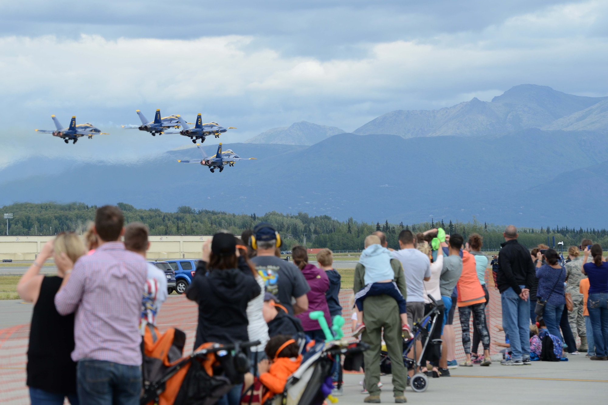 U.S. Navy Flight Demonstration Squadron, the Blue Angels, take-off during Arctic Thunder Special Needs and Family Day, July 29, 2016. JBER will open the doors to the public, showcasing more than 40 key performers and ground acts to include the JBER joint forces, U.S. Air Force F-22, and U.S. Navy Blue Angels demonstrations teams. (U.S Air Force photo by Airman 1st Class Javier Alvarez)