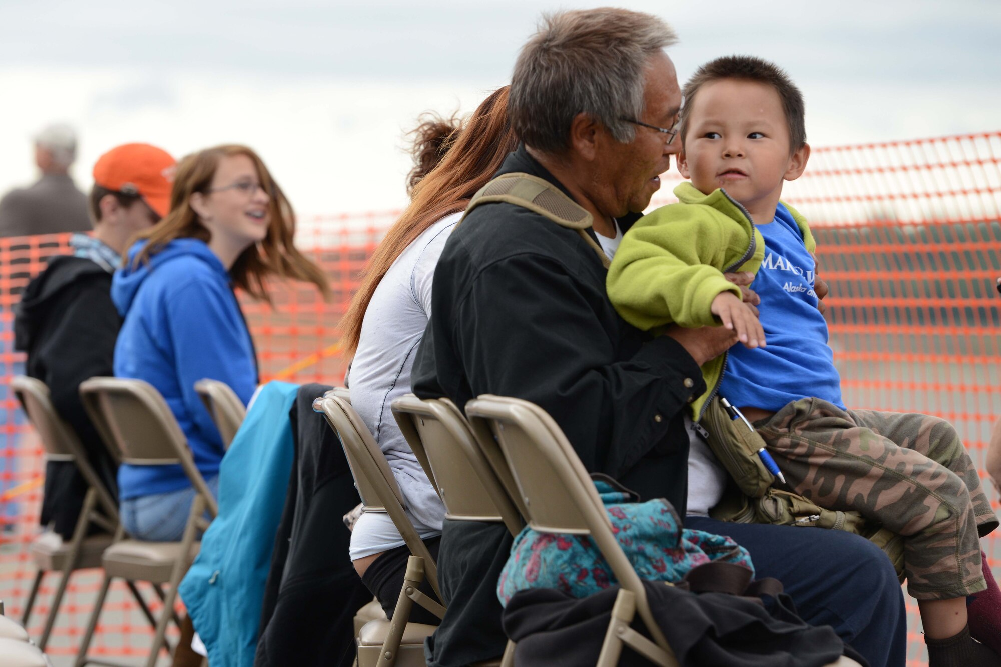 Allen Sagoonick, a former U.S. Marine, and son, Thomas, 4, watch as U.S. Navy Flight Demonstration Squadron, the Blue Angels, take-off during Arctic Thunder Special Needs and Family Day, July 29, 2016. JBER will open the doors to the public, showcasing more than 40 key performers and ground acts to include the JBER joint forces, U.S. Air Force F-22, and U.S. Navy Blue Angels demonstrations teams. (U.S Air Force photo by Airman 1st Class Javier Alvarez)