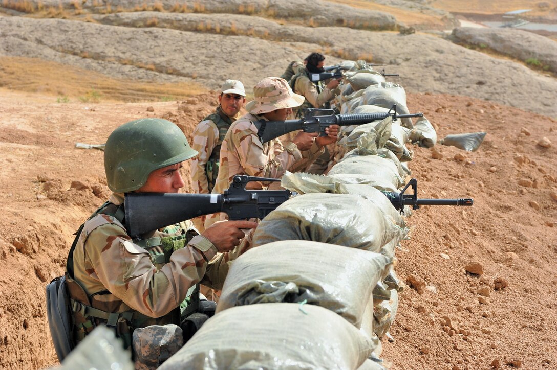 Peshmerga soldiers prepare for an anticipated attack along simulated front lines during training at the Manila Training Center in northern Iraq, July 26, 2016. Training included day and night defensive operations, movement to contact, and assaults on enemy-held objectives. The training marked the completion of the eight-week modern brigade course conducted by the coalition-led Kurdistan Training Coordination Center, a key piece of Combined Joint Task Force Operation Inherent Resolve’s multinational effort to train Iraqi security forces personnel to defeat the Islamic State of Iraq and the Levant. Army Photo by Maj. Allen Hill