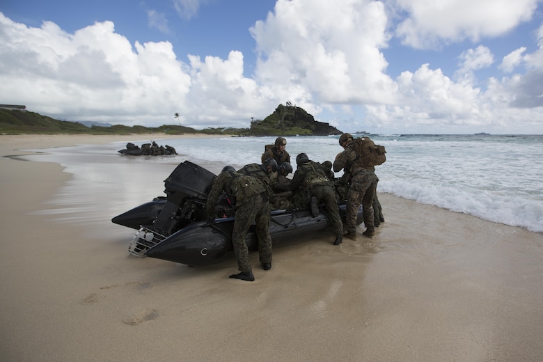 Japanese reconnaissance soldiers and U.S. Marines with 5th Air Naval Gunfire Liaison Company assault a beach during Rim of the Pacific 2016.  The assault was launched from USS San Diego and commanded by III Marine Expeditionary Force units aboard USS America.  Twenty-six nations, more than 40 ships and submarines, more than 200 aircraft and 25,000 personnel are participating in RIMPAC from June 30 to Aug. 4, in and around the Hawaiian Islands and Southern California. The world's largest international maritime exercise, RIMPAC provides a unique training opportunity that helps participants foster and sustain the cooperative relationships that are critical to ensuring the safety of sea lanes and security in the world's oceans. RIMPAC 2016 is the 25th exercise in the series that began in 1971. (U.S. Marine Corps photo by Lance Cpl. Matthew Casbarro/Released)