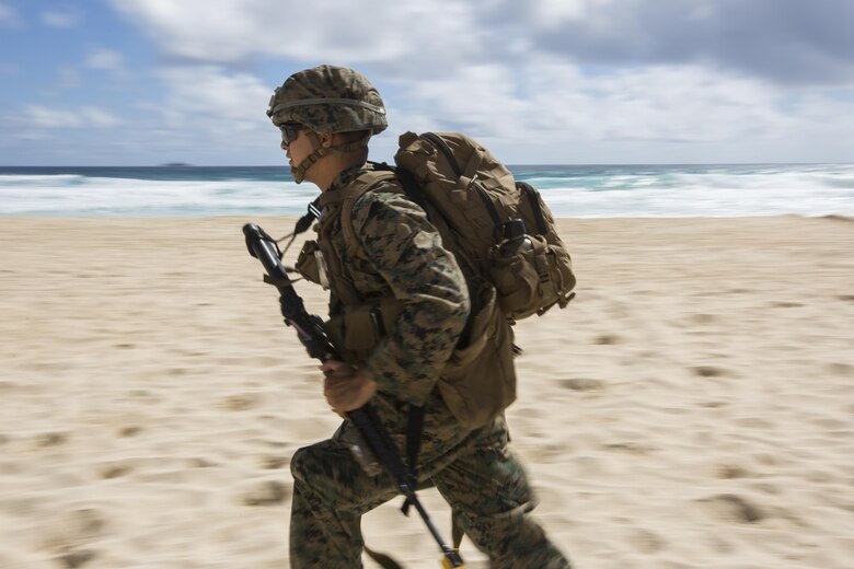 160730-M-GA922-1025 MARINE CORPS BASE, HAWAII (July 30, 2016) - A U.S. Marine with Company E, Battalion Landing Team 2nd Battalion, 3rd Marine Regiment, assaults a beach during Rim of the Pacific 2016. Twenty-six nations, more than 40 ships and submarines, more than 200 aircraft and 25,000 personnel are participating in RIMPAC from June 30 to Aug. 4, in and around the Hawaiian Islands and Southern California. The world's largest international maritime exercise, RIMPAC provides a unique training opportunity that helps participants foster and sustain the cooperative relationships that are critical to ensuring the safety of sea lanes and security in the world's oceans. RIMPAC 2016 is the 25th exercise in the series that began in 1971. (U.S. Marine Corps photo by Lance Cpl. Matthew Casbarro/Released)