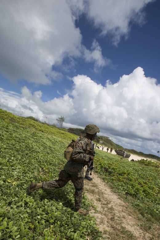 160730-M-GA922-1038 MARINE CORPS BASE, HAWAII (July 30, 2016) - A U.S. Marine with Company E, Battalion Landing Team 2nd Battalion, 3rd Marine Regiment, assaults a beach during Rim of the Pacific 2016. Twenty-six nations, more than 40 ships and submarines, more than 200 aircraft and 25,000 personnel are participating in RIMPAC from June 30 to Aug. 4, in and around the Hawaiian Islands and Southern California. The world's largest international maritime exercise, RIMPAC provides a unique training opportunity that helps participants foster and sustain the cooperative relationships that are critical to ensuring the safety of sea lanes and security in the world's oceans. RIMPAC 2016 is the 25th exercise in the series that began in 1971. (U.S. Marine Corps photo by Lance Cpl. Matthew Casbarro)