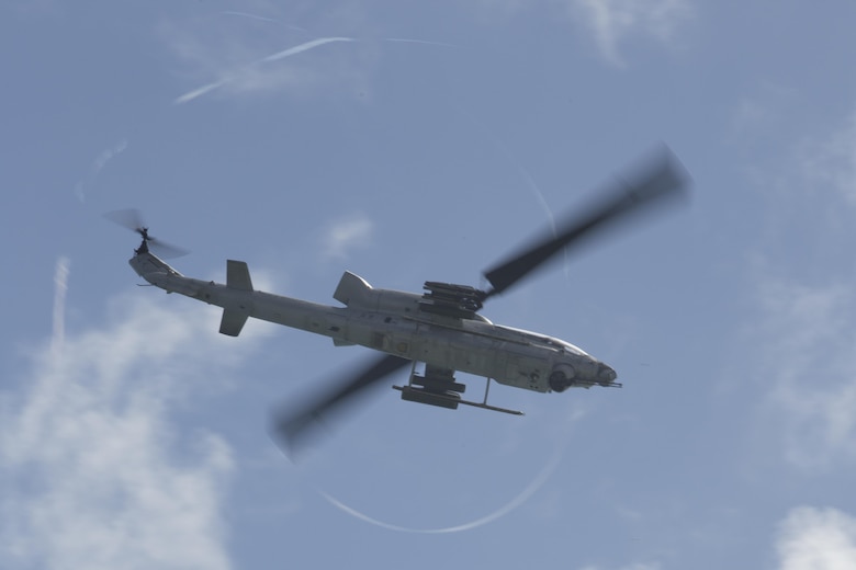 A U.S. Marine Corps AH-1W Super Cobra with Marine Light Attack Helicopter Squadron 367, Marine Aircraft Group 24, supports a beach assault during Rim of the Pacific 2016. Twenty-six nations, more than 40 ships and submarines, more than 200 aircraft and 25,000 personnel are participating in RIMPAC from June 30 to Aug. 8, in and around the Hawaiian Islands and Southern California. The world's largest international maritime exercise, RIMPAC provides a unique training opportunity that helps participants foster and sustain the cooperative relationships that are critical to ensuring the safety of sea lanes and security in the world's oceans. RIMPAC 2016 is the 25th exercise in the series that began in 1971. (U.S. Marine Corps photo by Lance Cpl. Matthew Casbarro)