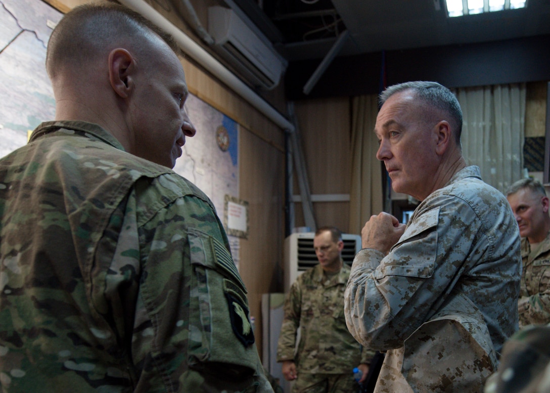 Marine Corps Gen. Joe Dunford, chairman of the Joint Chiefs of Staff, receives a campaign update from a U.S. service member near Irbil, Iraq, July 31, 2016. Dunford visited Iraq to assess the campaign against the Islamic State of Iraq and the Levant. DoD photo by Navy Petty Officer 2nd Class Dominique A. Pineiro
