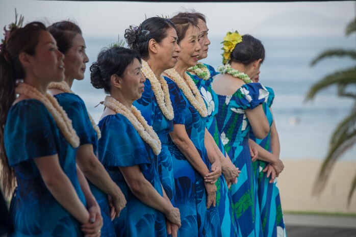 Hula dancers wait for their turn to perform during the U.S. – Japan Luau Party on Oshima Island, Japan, July 23, 2016. Residents of Marine Corps Air Station Iwakuni visited the island of Oshima to join in celebration of the island’s history and the bond between the U.S. and Japan. (U.S. Marine Corps photo by Cpl. Nathan Wicks)