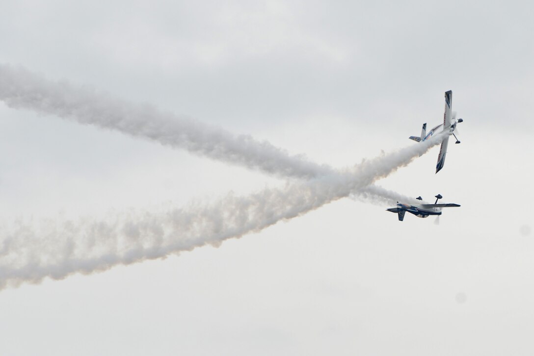 Eric Hansen, and Ken Fowler of Team Rocket perform aerial maneuvers during the Arctic Thunder Open House at Joint Base Elmendorf-Richardson, Alaska on July 31, 2016. The event featured more than 40 key performers and ground acts to include the JBER joint forces, U.S. Air Force F-22, and U.S. Navy Blue Angels demonstrations teams. (U.S. Air Force photo by Airman 1st Class Christopher R. Morales)