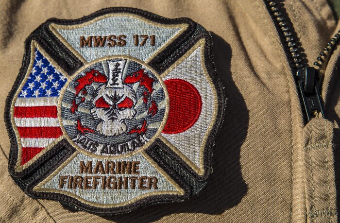 U.S. Marine Corps Cpl. Michael Barton, an aircraft rescue firefighter specialist with Marine Wing Support Squadron (MWSS) 171, sports an MWSS-171 Marine Firefighter patch during Exercise Pitch Black 2016 at Royal Australian Air Force Base Tindal, Australia, July 28, 2016. Barton is a liaison between Marine Fighter Attack Squadron (VMFA) 122 and No. 17 Squadron Fire and Rescue team stationed at RAAF Tindal, in case of emergencies with the flying squadron’s aircraft during the exercise. Pitch Black is a multination exercise that also includes participation from Canada, France, Italy, Germany, Indonesia, Netherlands, New Zealand, Singapore and Thailand. (U.S. Marine Corps photo by Cpl. Nicole Zurbrugg)