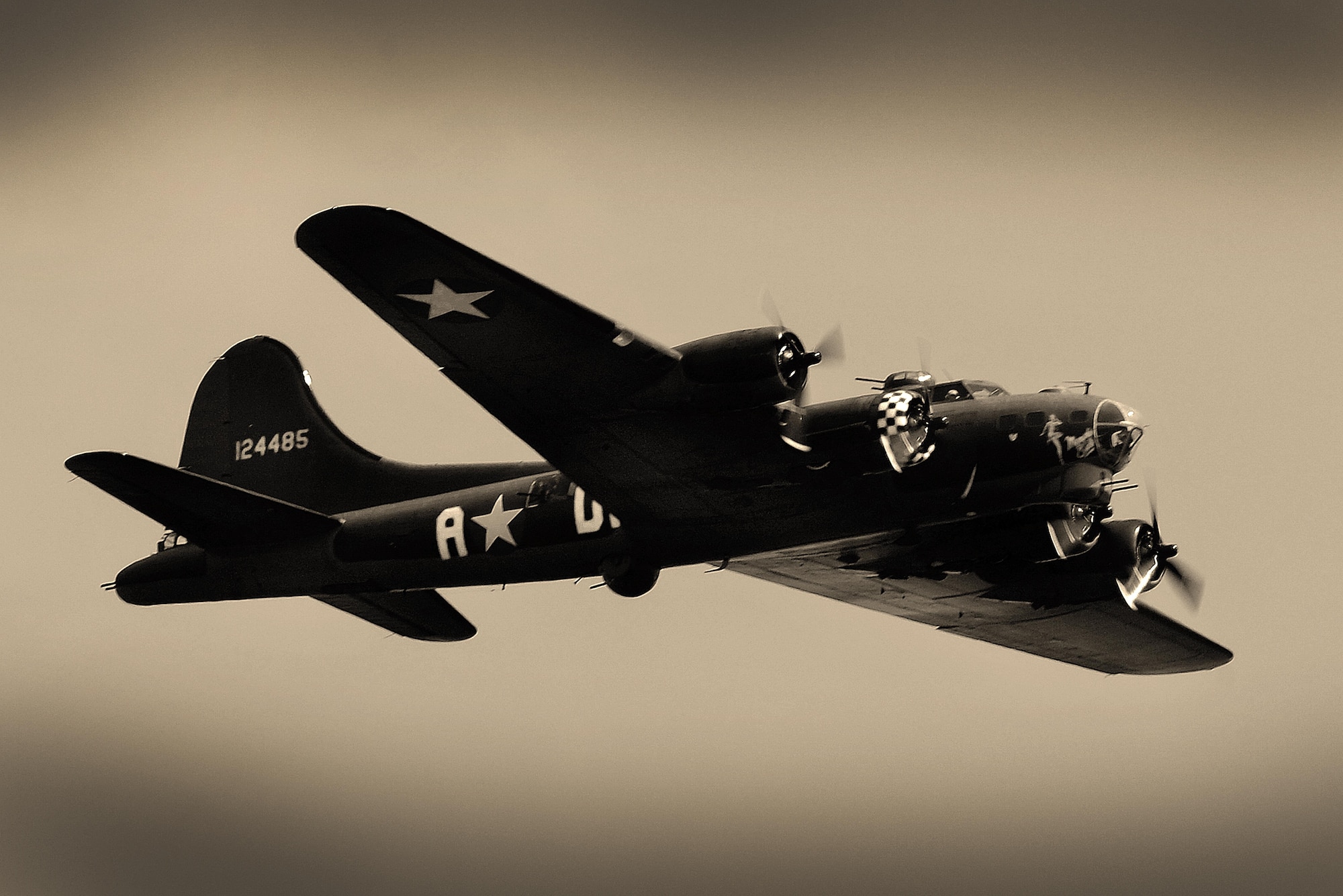 A B-17 Flying Fortress performs a flyover during the unveiling of the 490th Bombardment Group Memorial, May 29, in the village of Brome, England. The ceremony was the culmination of a two-year effort by a small group of United Kingdom citizens from the Eye area of Suffolk to create a permanent monument dedicated to the men of the 490th for their contributions during World War II. (U.S. Air Force photo/ Tech Sgt. Matthew Plew)