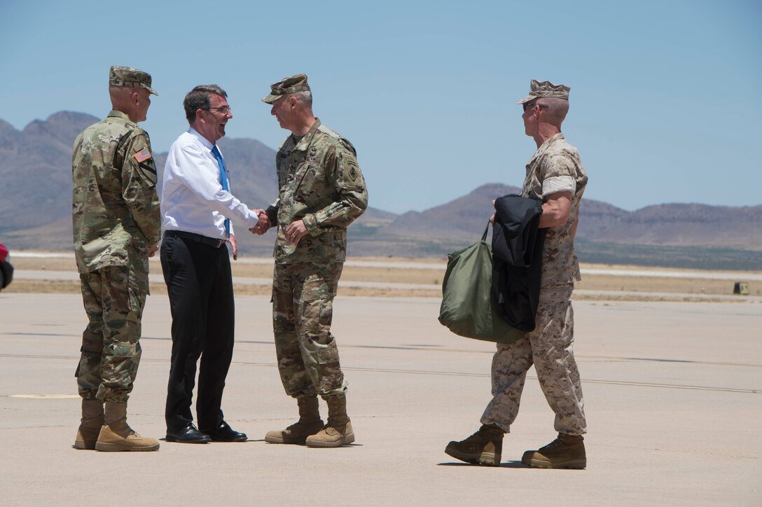 Defense Secretary Ash Carter speaks to Army Maj. Gen. Scott Berrier and Army Maj. Gen. John Morrison as he prepares to leave Fort Huachuca, Ariz., May 31, 2016. DoD photo by Navy Petty Officer 1st Class Tim D. Godbee