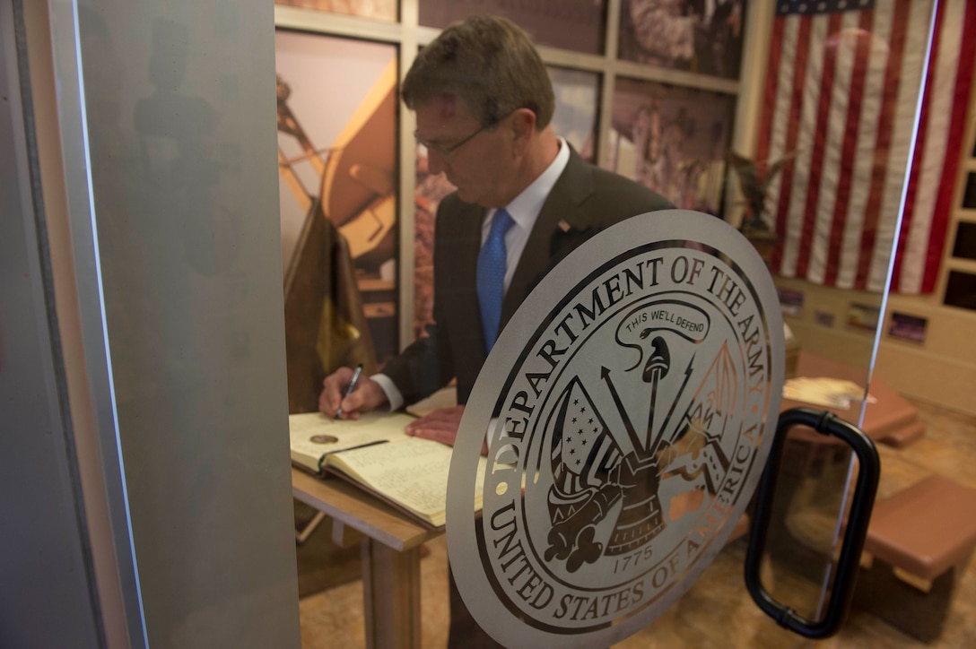 Defense Secretary Ash Carter signs the guest book at the Signal Cove of Remembrance at Fort Huachuca, Ariz., May 31, 2016. DoD photo by Navy Petty Officer 1st Class Tim D. Godbee