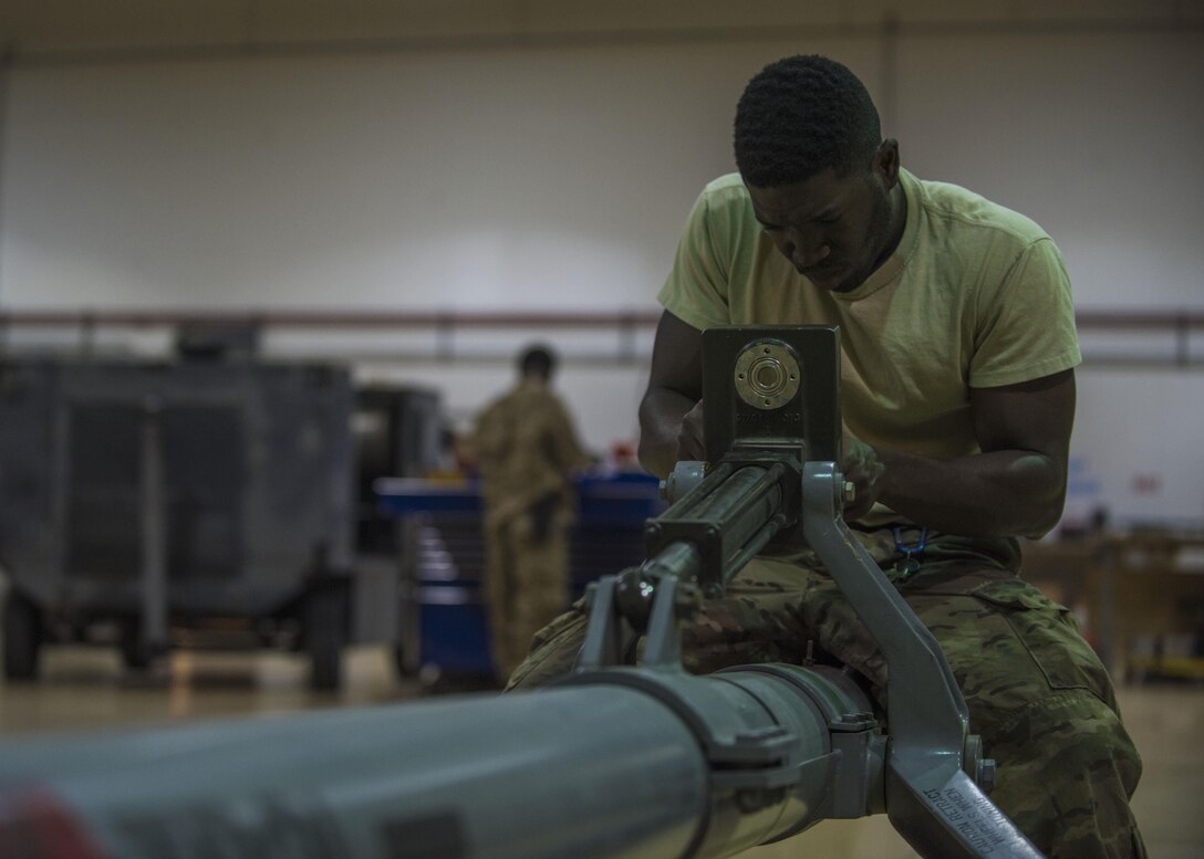 Staff Sgt. Quinton Glover, 455th Expeditionary Aircraft Maintenance Squadron aerospace ground equipment technician, repairs an aircraft tow bar at Bagram Airfield, Afghanistan, May 31, 2016. AGE inspects ground equipment parts monthly and provides pick-up and delivery of equipment daily. (U.S. Air Force photo by Senior Airman Justyn M. Freeman)