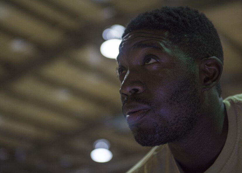 Staff Sgt. Quinton Glover, 455th Expeditionary Aircraft Maintenance Squadron aerospace ground equipment technician, speaks with another Airman as they repair an aircraft tow bar at Bagram Airfield, Afghanistan, May 31, 2016. Bagram has four different AGE units, and each unit is responsible for inspecting, maintaining, and delivering equipment to their sector of the base. (U.S. Air Force photo by Senior Airman Justyn M. Freeman)