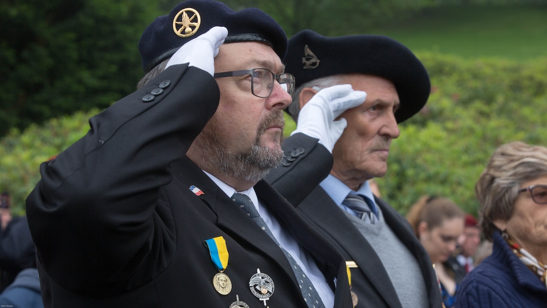 Guests salute the French flag during a Memorial Day ceremony in which U.S. Marines performed alongside the French Army at the Aisne-Marne American Memorial Cemetery in Belleau, France, May 29, 2016. The French and the Americans gathered together, as they do every year, to honor those service members from both countries who have fallen in WWI, Belleau Wood and throughout history, fighting side by side. The Marines also remembered those they lost in the Battle of Belleau Wood 98 years ago.