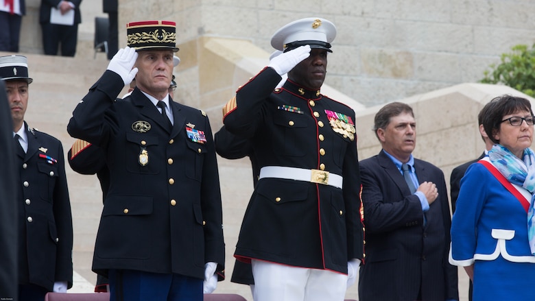 Members of the official party, including Sgt. Maj. Ronald L. Green, Sergeant Major of the Marine Corps, salute during a Memorial Day ceremony in which U.S. Marines performed alongside the French Army at the Aisne-Marne American Memorial Cemetery in Belleau, France, May 29, 2016. The French and the Americans join together, as they do every year, to honor those service members from both countries who have fallen in WWI, Belleau Wood and throughout history, fighting side by side. The Marines also remembered those they lost in the Battle of Belleau Wood 98 years ago.