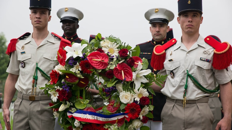 French soldiers and U.S. Marines carry wreaths during a Memorial Day ceremony in which U.S. Marines performed alongside the French Army at the Aisne-Marne American Memorial Cemetery in Belleau, France, May 29, 2016. The French and the Americans gathered together, as they do every year, to honor those service members from both countries who have fallen in WWI, Belleau Wood and throughout history, fighting side by side. The Marines also remembered those they lost in the Battle of Belleau Wood 98 years ago.