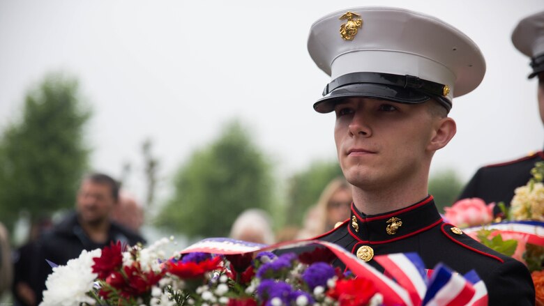 A U.S. Marine carries a wreath during a Memorial Day ceremony in which U.S. Marines performed alongside the French Army at the Aisne-Marne American Memorial Cemetery in Belleau, France, May 29, 2016. The French and the Americans gathered together, as they do every year, to honor those service members from both countries who have fallen in WWI, Belleau Wood and throughout history, fighting side by side. The Marines also remembered those they lost in the Battle of Belleau Wood 98 years ago.