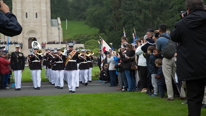 Guests take pictures and cheer for the 2nd Marine Division band during a Memorial Day ceremony in which U.S. Marines performed alongside the French Army at the Aisne-Marne American Memorial Cemetery in Belleau, France, May 29, 2016. The French and the Americans gathered together, as they do every year, to honor those service members from both countries who have fallen in WWI, Belleau Wood and throughout history, fighting side by side. The Marines also remembered those they lost in the Battle of Belleau Wood 98 years ago.
