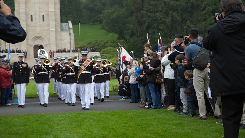 Guests take pictures and cheer for the 2nd Marine Division band during a Memorial Day ceremony in which U.S. Marines performed alongside the French Army at the Aisne-Marne American Memorial Cemetery in Belleau, France, May 29, 2016. The French and the Americans gathered together, as they do every year, to honor those service members from both countries who have fallen in WWI, Belleau Wood and throughout history, fighting side by side. The Marines also remembered those they lost in the Battle of Belleau Wood 98 years ago.