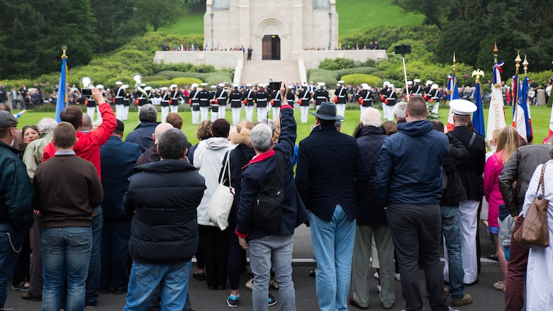 Guests take pictures of the 2nd Marine Division band during a Memorial Day ceremony in which U.S. Marines performed alongside the French Army at the Aisne-Marne American Memorial Cemetery in Belleau, France, May 29, 2016. The French and the Americans gathered together, as they do every year, to honor those service members from both countries who have fallen in WWI, Belleau Wood and throughout history, fighting side by side. The Marines also remembered those they lost in the Battle of Belleau Wood 98 years ago.