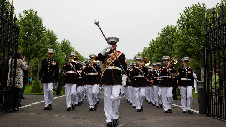 Marines from the 2nd Marine Division band exit the cemetary after a Memorial Day ceremony in which U.S. Marines performed alongside the French Army at the Aisne-Marne American Memorial Cemetery in Belleau, France, May 29, 2016. The French and the Americans gathered together, as they do every year, to honor those service members from both countries who have fallen in WWI, Belleau Wood and throughout history, fighting side by side. The Marines also remembered those they lost in the Battle of Belleau Wood 98 years ago.