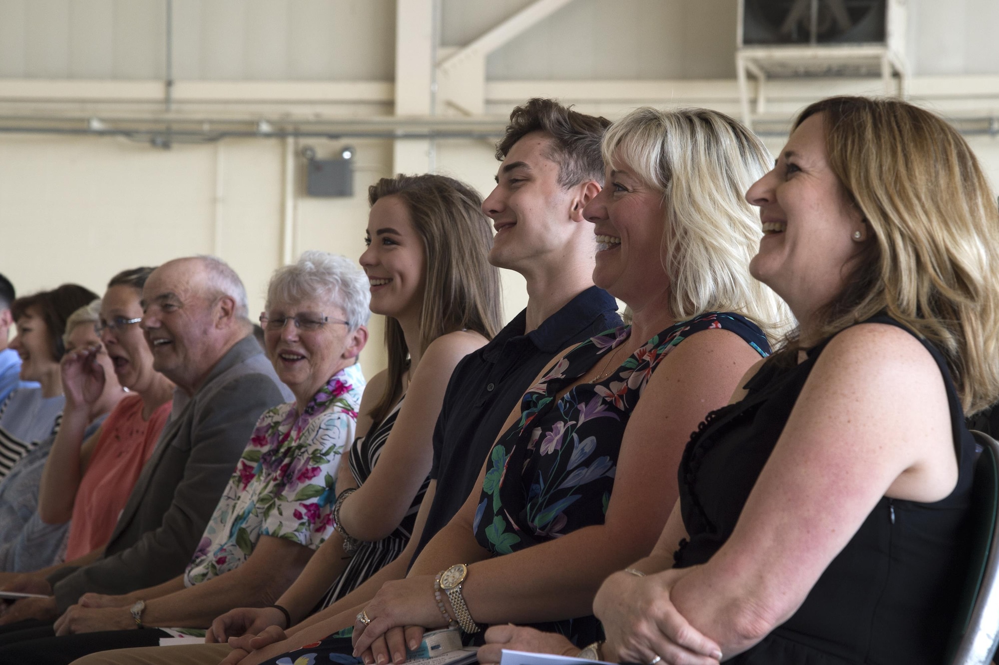 Family and friends of U.S. Air Force Chief Master Sgt. David Kelch, 23d Wing command chief, share a laugh during his retirement ceremony at Moody Air Force Base, Ga., May 26, 2016. The ceremony included remarks from Brig. Gen Chad Franks, senior executive officer to the Air Force vice chief of staff, a tribute by Moody’s First Sergeant Association and a flag presentation. (U.S. Air Force photo by Airman 1st Class Janiqua P. Robinson/Released)