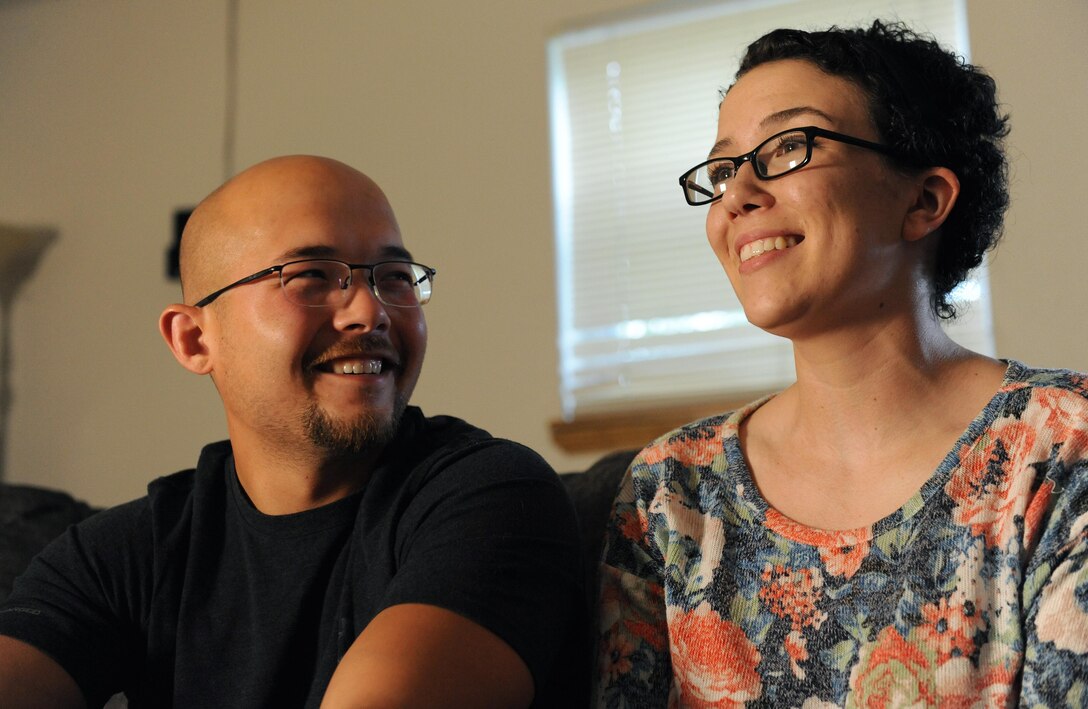 U.S. Air Force Staff Sgt. Lauren Palmer, a 509th Aircraft Maintenance Squadron commander support staff personnel craftsman, right, and her husband, David Roberts, reminisce on past trials and triumphs May 13, 2016. The couple told their story about the journey after Palmer was diagnosed with Hodgkin’s lymphoma in October 2014. (U.S. Air Force photo by Airman 1st Class Michaela R. Slanchik)
