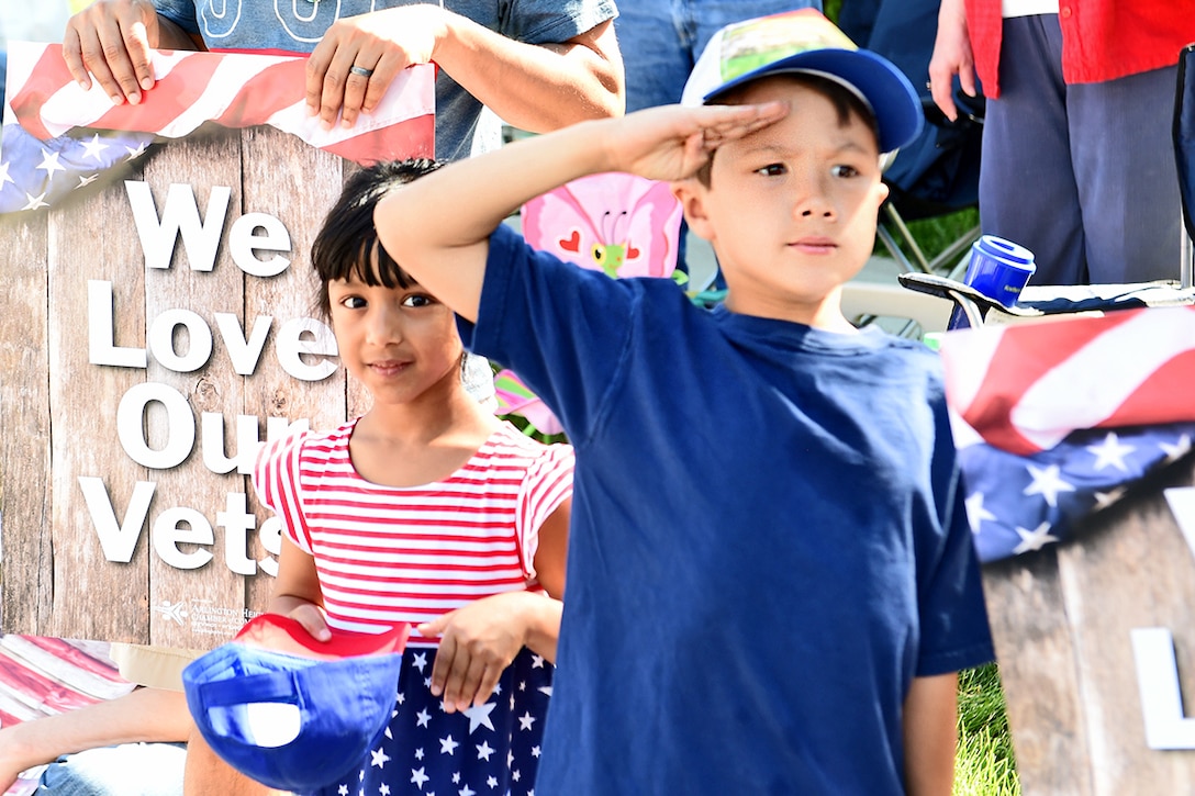 Leo, 7, Buffalo Grove resident, salutes during the Memorial Day Parade in Arlington Heights, Ill. An estimated 10,000 people watched the parade under sunny skies on Monday, May 30th, 2016.  
(U.S. Army photo by Sgt. Aaron Berogan/Released)