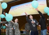 Participants release their message balloons during the “A walk down memory lane” event at Schriever Air Force Base, Colorado, and Thursday, May 26, 2016.The event was an opportunity for the Schriever community to come together and remember their loved ones who have passed away. (U.S. Air Force photo/Staff Sgt. Matthew Coleman-Foster)