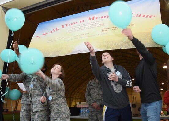 Participants release their message balloons during the “A walk down memory lane” event at Schriever Air Force Base, Colorado, and Thursday, May 26, 2016.The event was an opportunity for the Schriever community to come together and remember their loved ones who have passed away. (U.S. Air Force photo/Staff Sgt. Matthew Coleman-Foster)