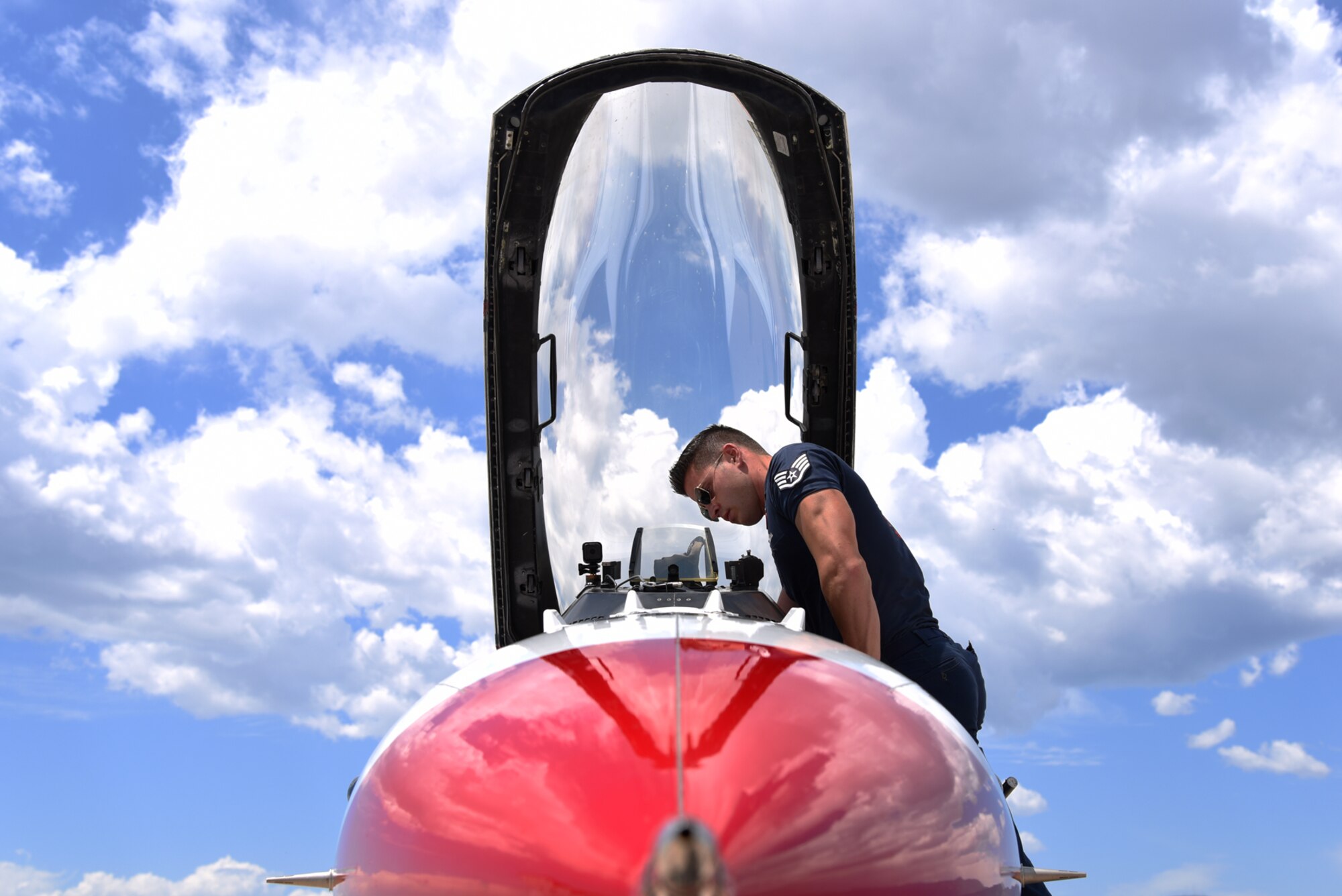 Staff Sgt. Andrew Molina, Air Force Thunderbirds aircraft structural maintainer, performs a post flight inspection at Peterson Air Force Base, Colo., on May 30, 2016. The U.S. Air Force Thunderbirds are in Colorado in preparation for a flyover at the Unites States Air Force Academy graduation. (U.S. Air Force photo by Airman 1st Class Dennis Hoffman)