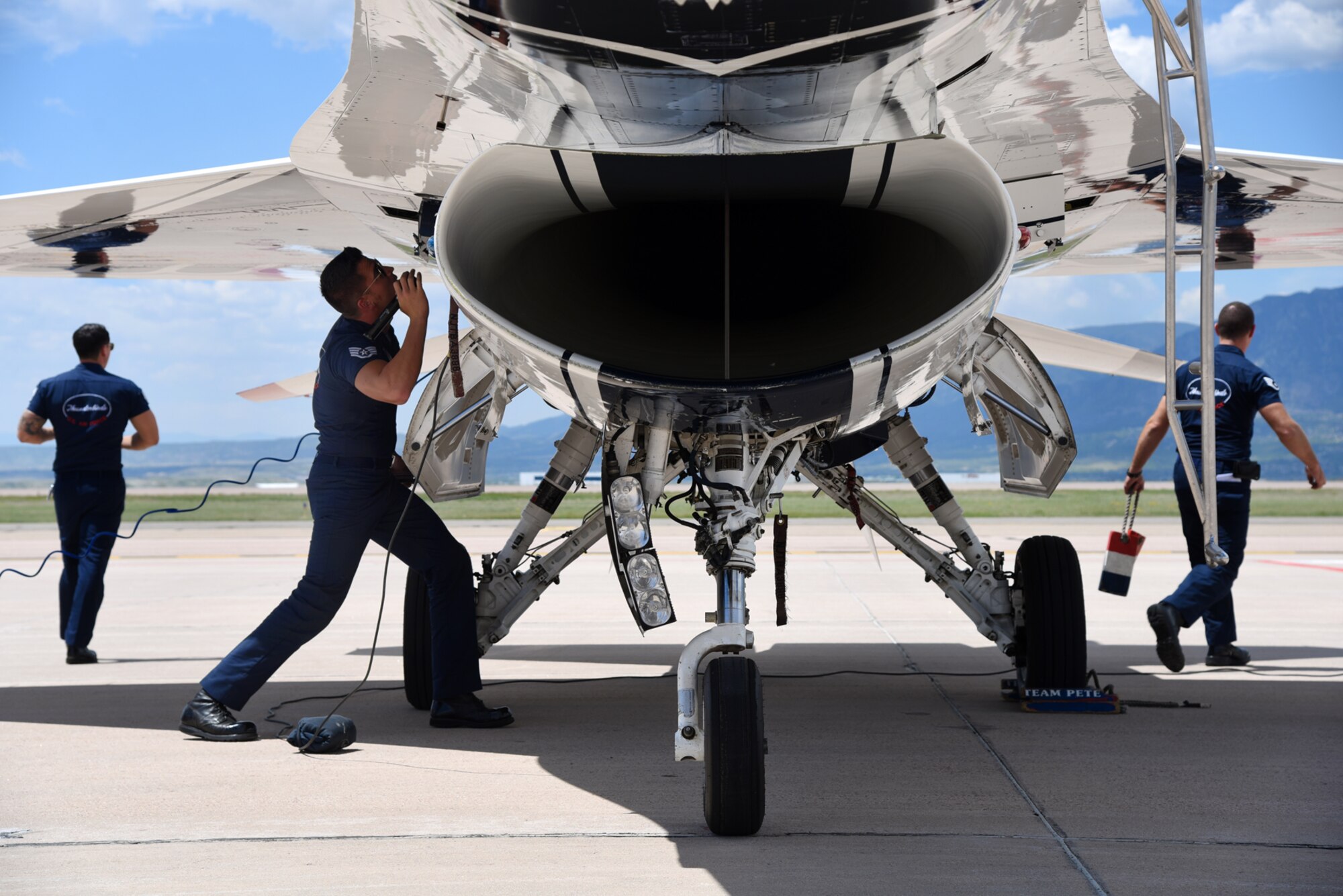 Air Force Thunderbird maintainers, perform post flight inspections on Thunderbird aircraft at Peterson Air Force Base, Colo., on May 30, 2016. The squadron performs approximately 75 demonstrations each year and has never canceled a demonstration due to maintenance difficulty. (U.S. Air Force photo by Airman 1st Class Dennis Hoffman)
