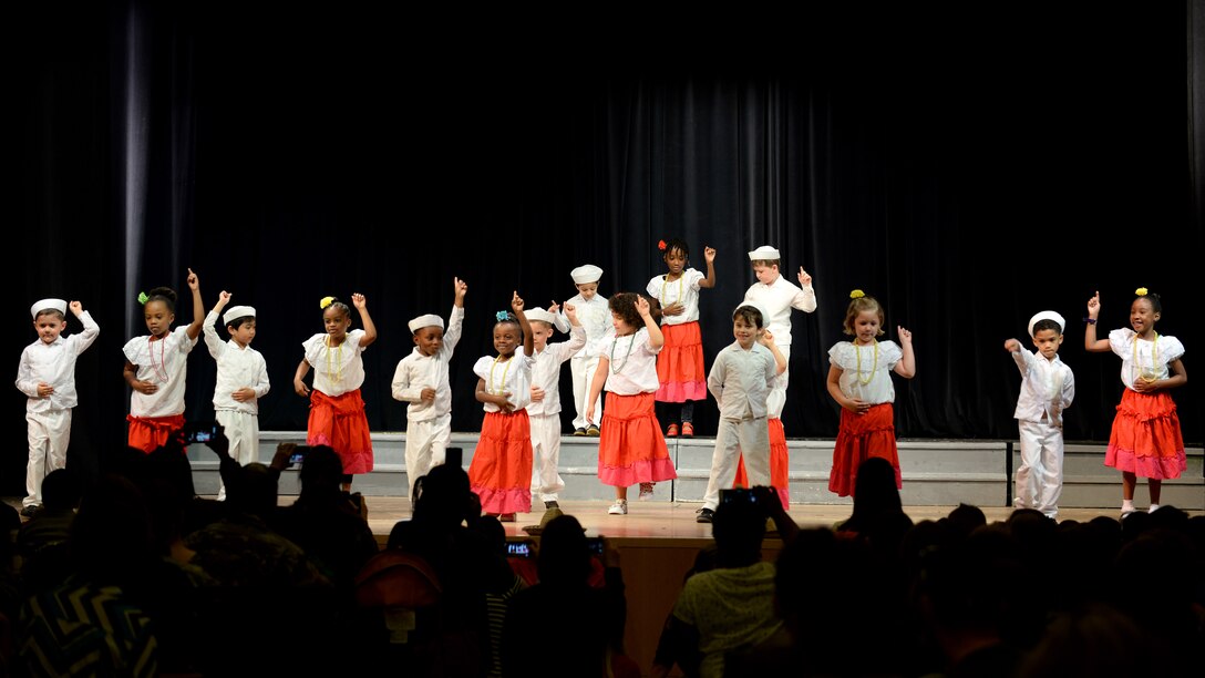 Aviano Elementary School kindergarteners dance the merengue during the end-of-year celebration, June 1, 2016, at Aviano Air Base, Italy. The event helped celebrate cultural differences and diversity. (U.S. Air Force photo by Airman 1st Class Cary Smith/Released)