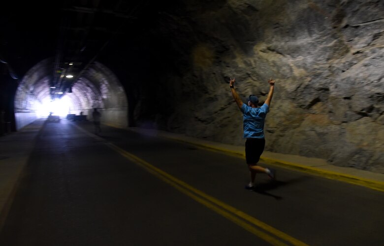 Runners celebrate finally seeing the light at the end of the tunnel during the Cheyenne Mountain Air Force Station 5k Tunnel Run/Open House at Cheyenne Mountain Air Force Station, Colo., on May 26, 2016. Since its inception during the Cold War through the war on terrorism, Cheyenne Mountain has remained critical to the defense mission providing command and control for the nation since 1966. Cheyenne Mountain AFS is owned by the 21st Space Wing at Peterson Air Force Base, and operated by the 721st Mission Support Group. (U.S. Air Force photo by Airman 1st Class Dennis Hoffman)