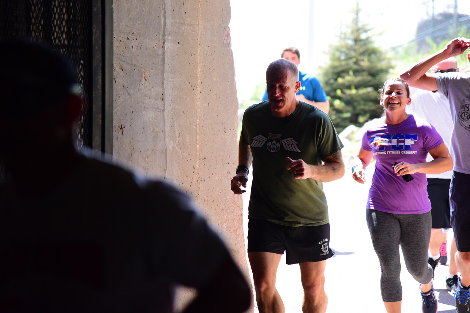 Runners trade the sun for the cool dark at the south entrance of the tunnel into Cheyenne Mountain Air Force Station during the CMAFS 5k Tunnel Run/Open House May 26, 2016. Since its inception during the Cold War through the war on terrorism, Cheyenne Mountain has remained critical to the defense mission providing command and control for the nation since 1966. (U.S. Air Force photo by Staff Sgt. Amber Grimm)
