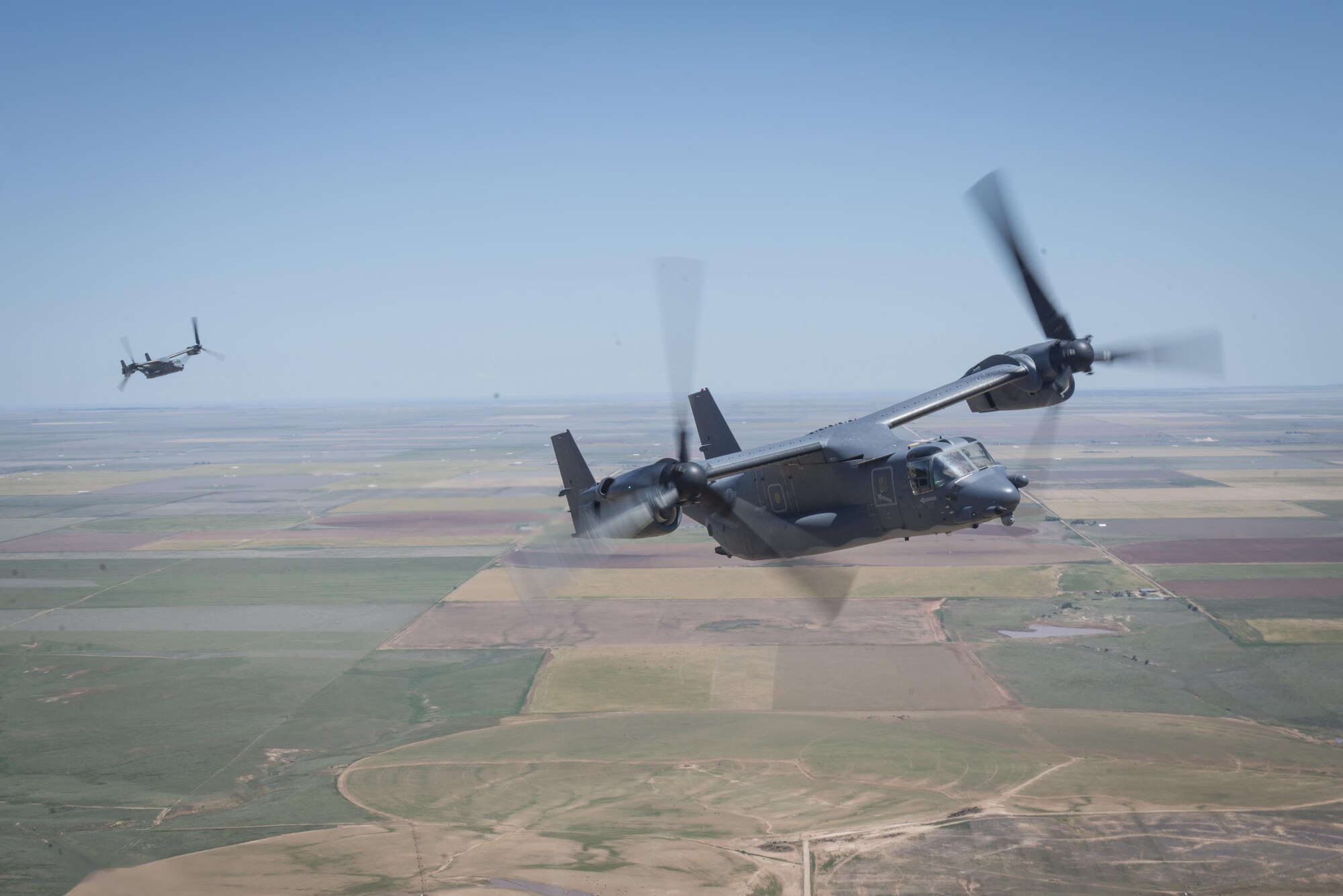 CV-22 Ospreys with the 20th Special Operations Squadron trail behind an MC-130J Commando II during the Air Commando Capabilities Demonstration at the Air Commandos on the High Plains air show May 28, 2016 at Cannon Air Force Base, N.M.  The 2016 Cannon Air Show highlights the unique capabilities and qualities of Cannon's Air Commandos and also celebrates the long-standing relationship between the 27th Special Operations Wing and the High Plains community. (U.S. Air Force photo/Senior Airman Shelby Kay-Fantozzi)