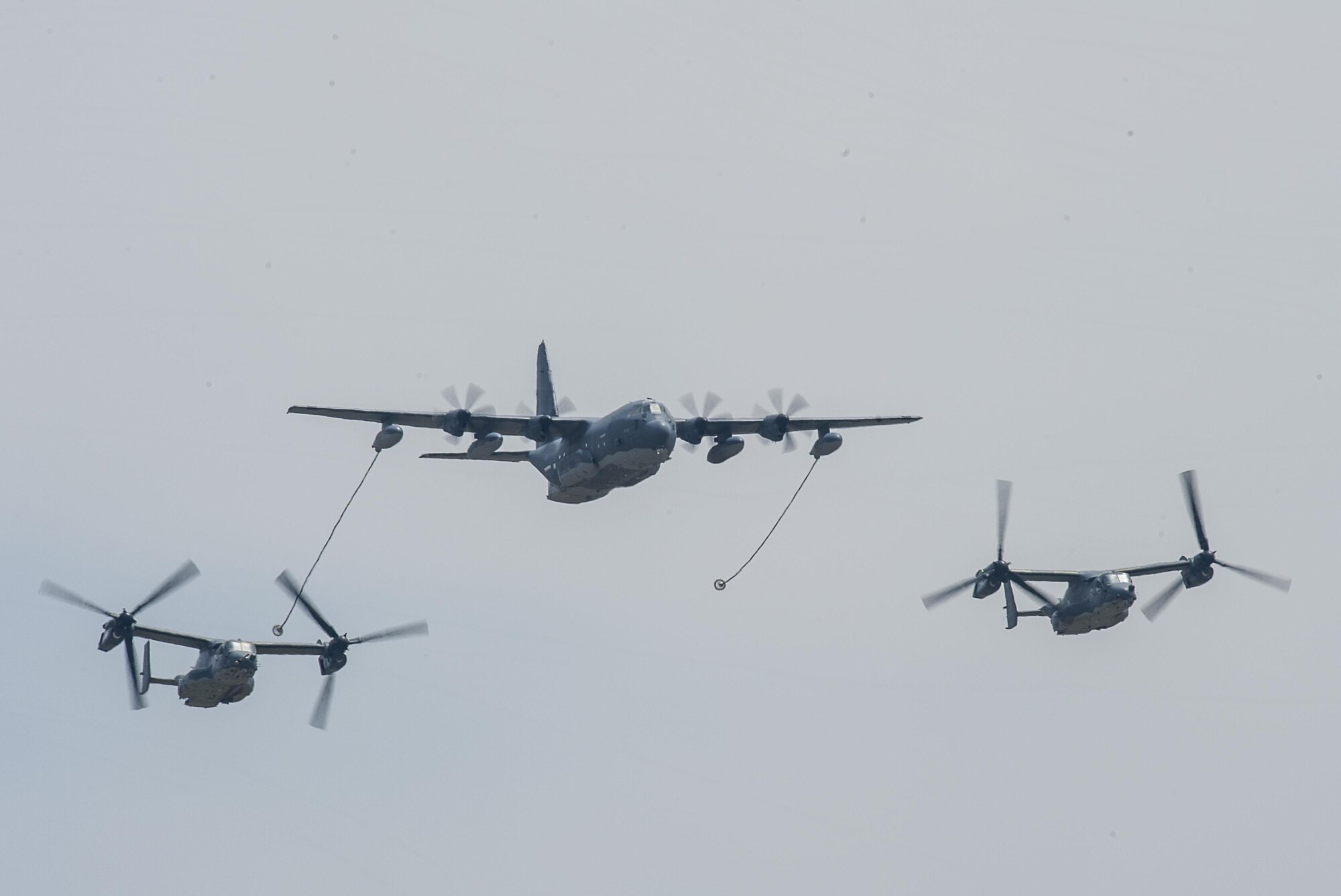 CV-22 Ospreys with the 20th Special Operations Squadron trail behind an MC-130J Commando II during the Air Commando Capabilities Demonstration at the 2016 Cannon Air Show May 28, 2016, at Cannon Air Force Base, N.M.  The 2016 Cannon Air Show highlights the unique capabilities and qualities of Cannon's Air Commandos and also celebrates the long-standing relationship between the 27th Special Operations Wing and the High Plains community. (U.S. Air Force photo/Master Sgt. Dennis Henry Jr.)