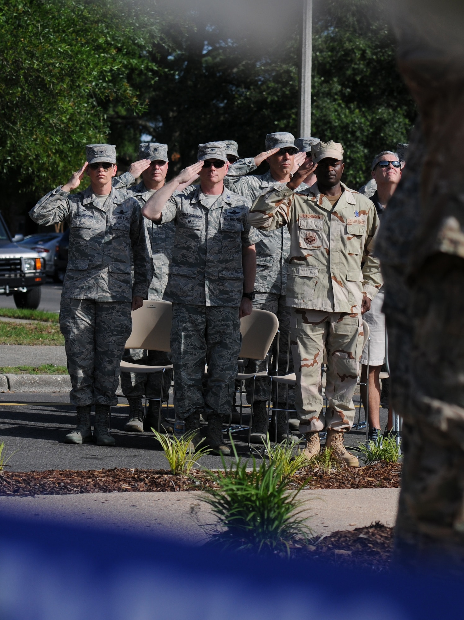 Keesler leadership render a salute during the 81st Training Wing Memorial Day Retreat Ceremony May 26, 2016, Keesler Air Force Base, Miss. The ceremony was held in memory of Operation Desert Storm. Attendees were also encouraged to wear uniforms from their past deployments. (U.S. Air Force photo by Kemberly Groue)