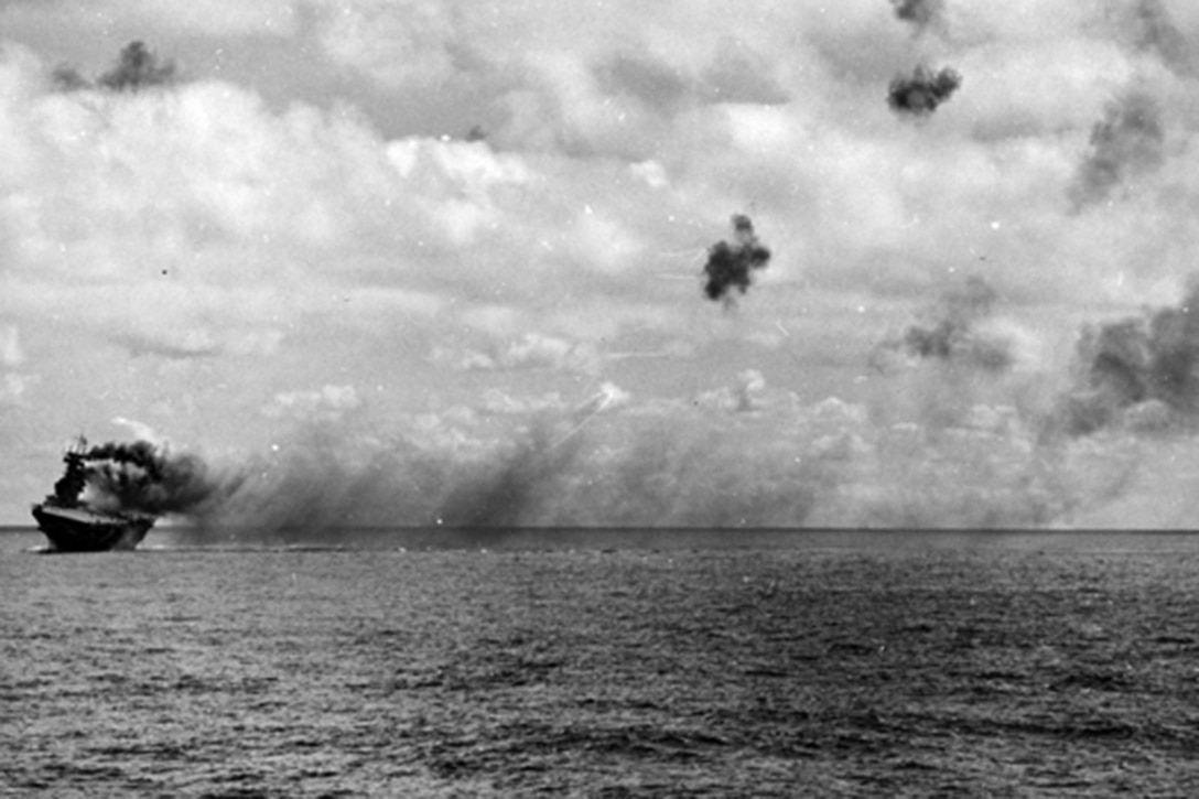 USS Yorktown burning during the Battle of Midway, June 1942. 