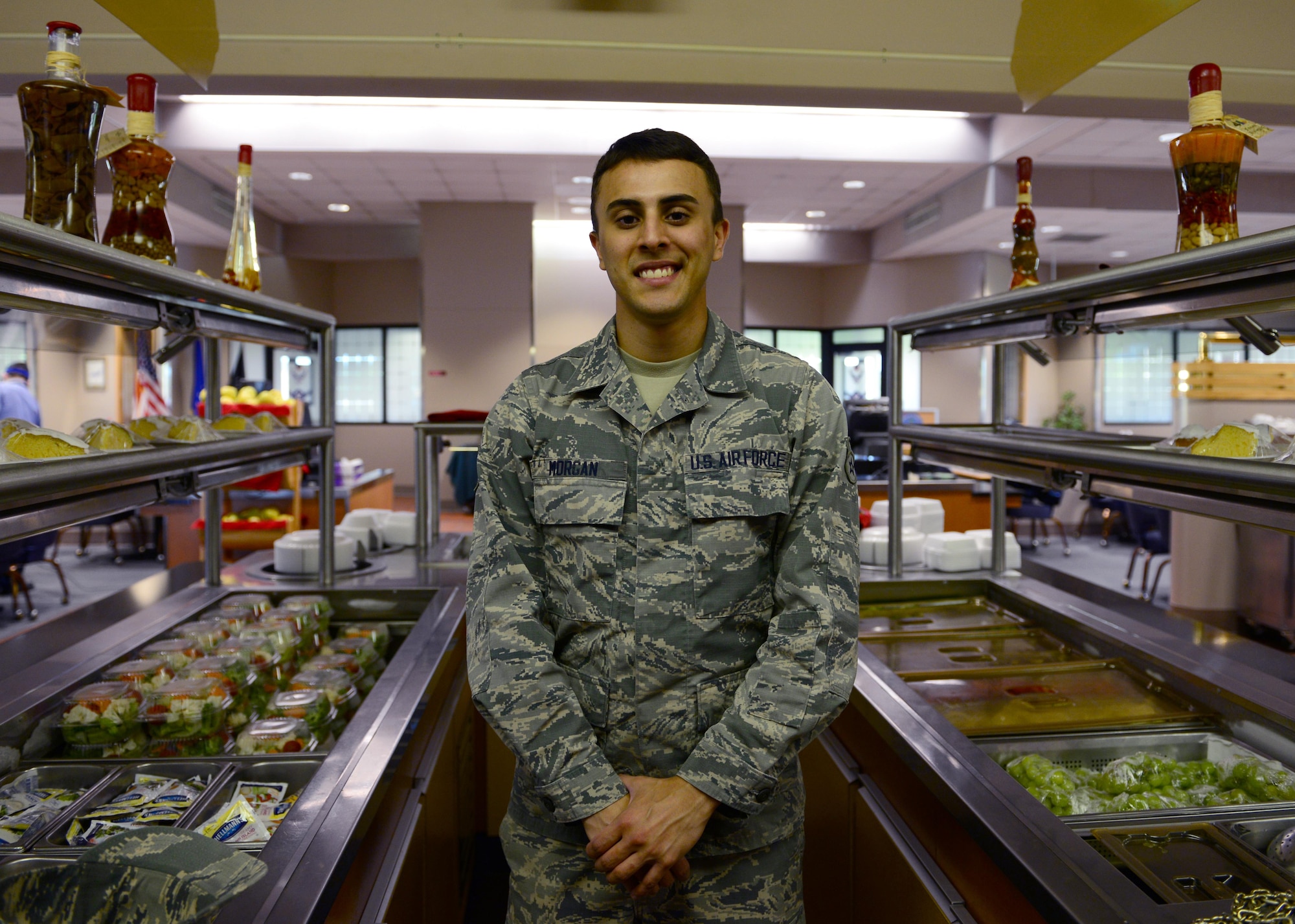 U.S. Air Force Airman Tyler Morgan, a 354th Force Support Squadron food service apprentice, takes a quick break for a photo May 31, 2016, at Eielson Air Force Base, Alaska. Morgan said his mother inspires him as a single mother, raising him and his siblings and always pushing them to be all they could be. (U.S. Air Force photo by Airman 1st Class Cassandra Whitman/Released)